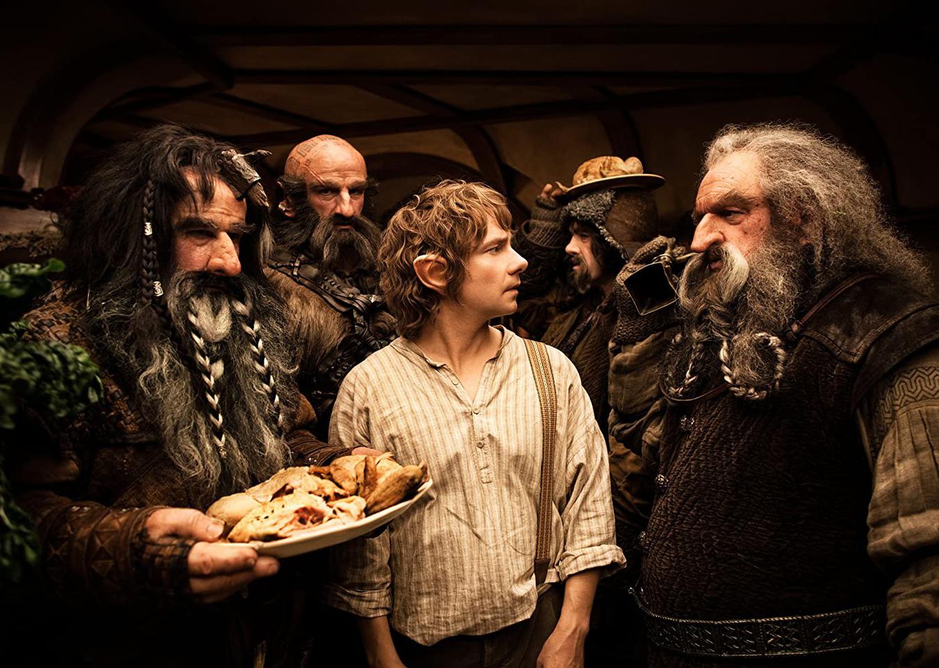 In LOTR: The Fellowship of the Ring (2001), three of the Dwarf Lords are  played by members of WETA Workshop, the SFX company who worked on the  trilogy. Full details in comments. 