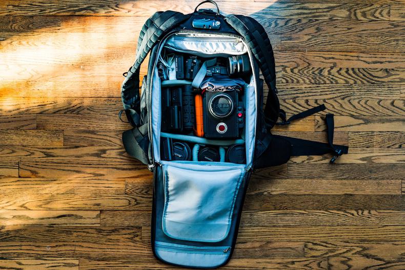 Camera bag containing a camera and lenses