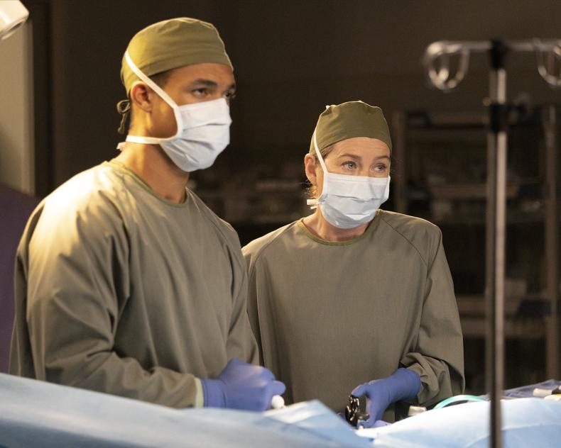 Two doctors wearing masks and gloves