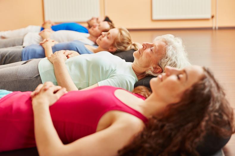 Group of people doing breathing exercises