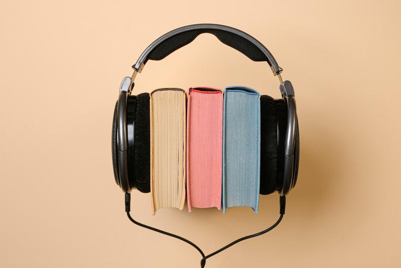 Books between a pair of headphones