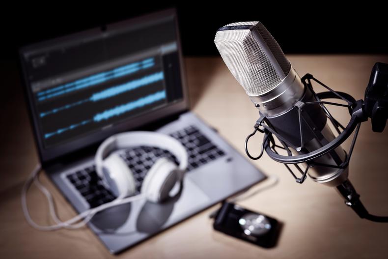 Microphone with other recording equipment in the background