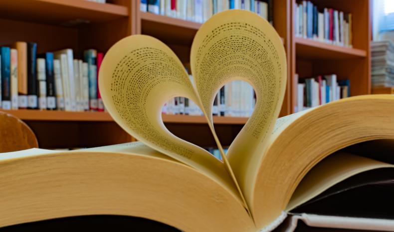 Book pages bent in the shape of a heart