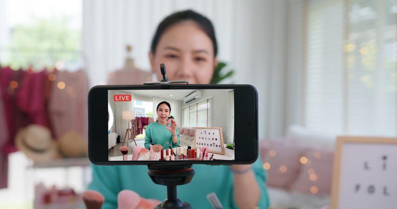 Woman recording a video for social media
