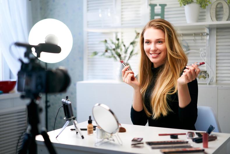Makeup influencer recording a video