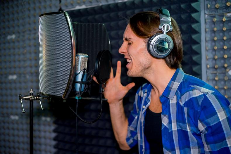 Voice actor recording in studio