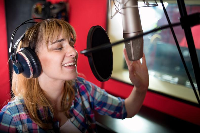 Woman performing in a voiceover studio