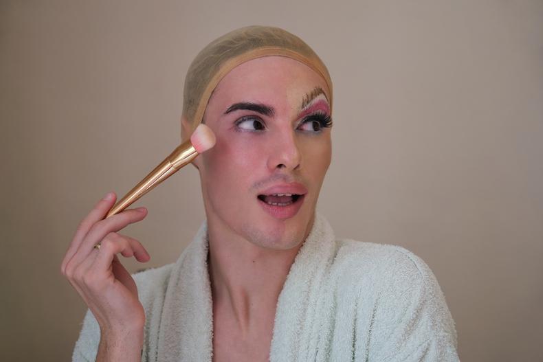 Drag queen applying makeup
