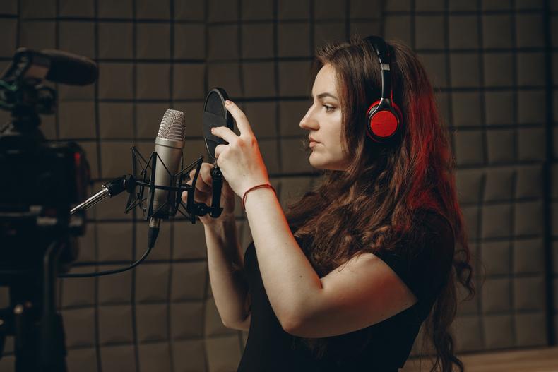 Voice actor in a recording studio