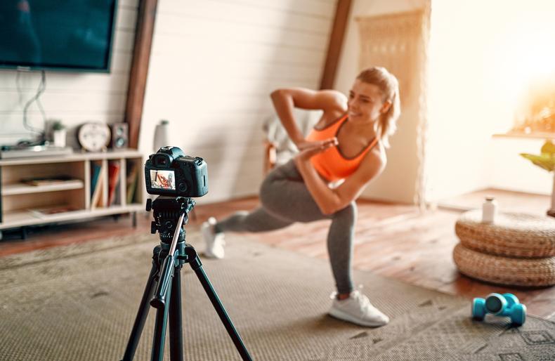 Woman exercising in front of a camera