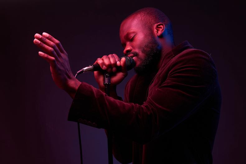 Man singing with microphone in hand