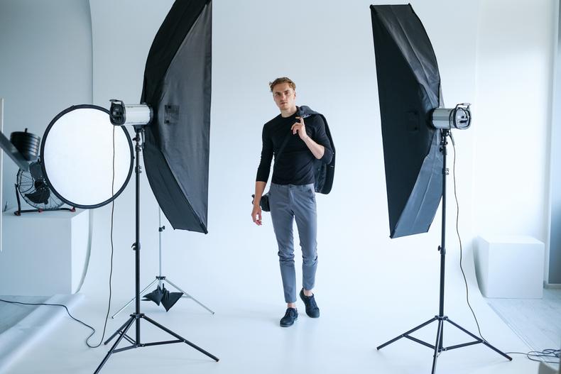 Man posing for a headshot in a studio