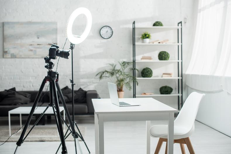 Ring light set up with a camera in front of a desk