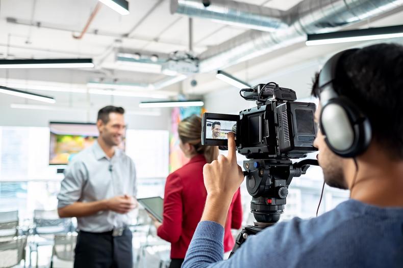 Role-playing actor being filmed