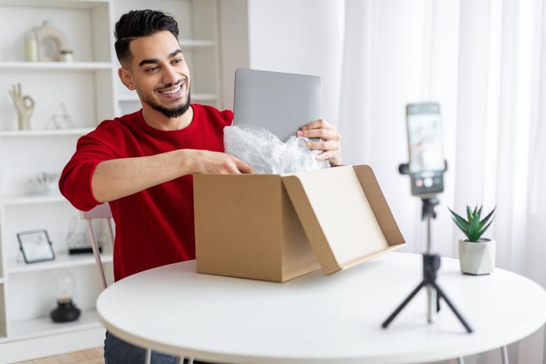 Man recording an unboxing video