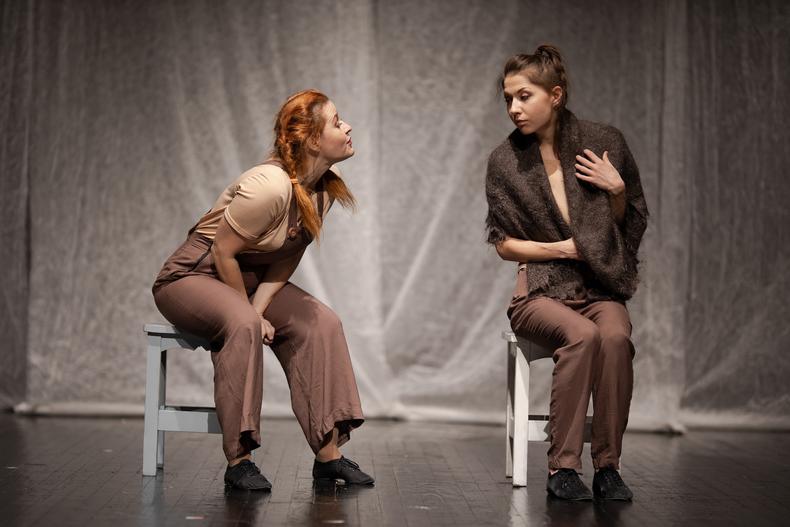 Two actors performing a duet scene on stage