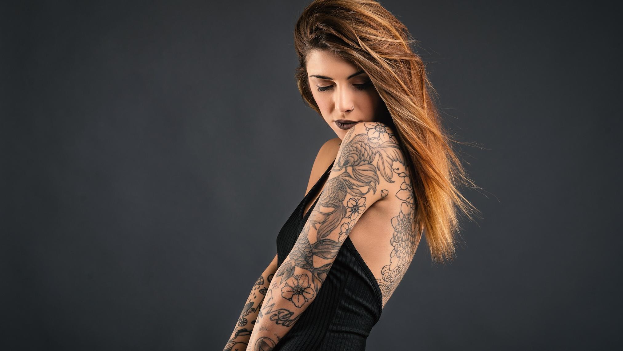 Glamour Plus Size Model Covered In Tattoos In Lingerie And Leather On Gray  Background Stock Photo Picture And Royalty Free Image Image 193071910