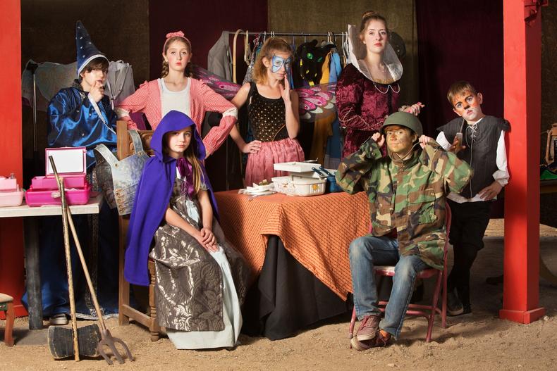 Child actors in costumes backstage