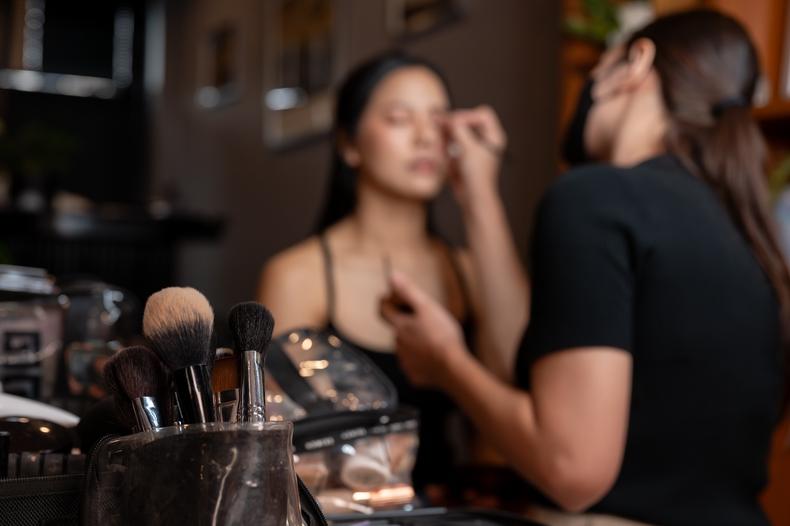 Actors getting makeup done on set