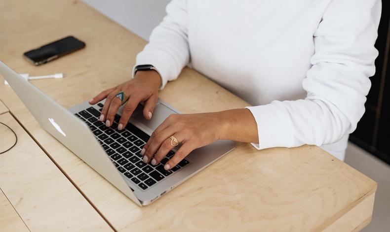 typing on laptop