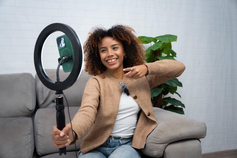 influencer holding ring light